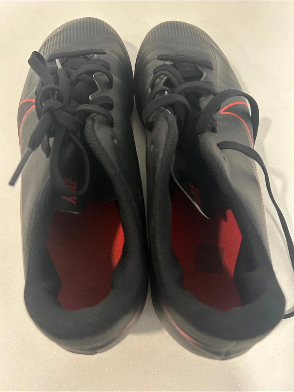 Kids Black Soccer Cleats with Red Accents